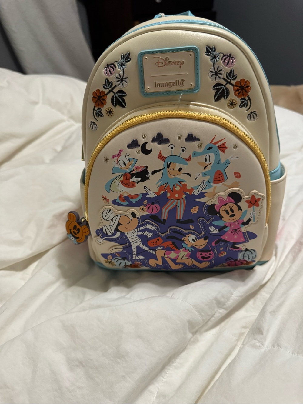 Loungefly Cream Mini Backpack with Colorful Disney Halloween Art